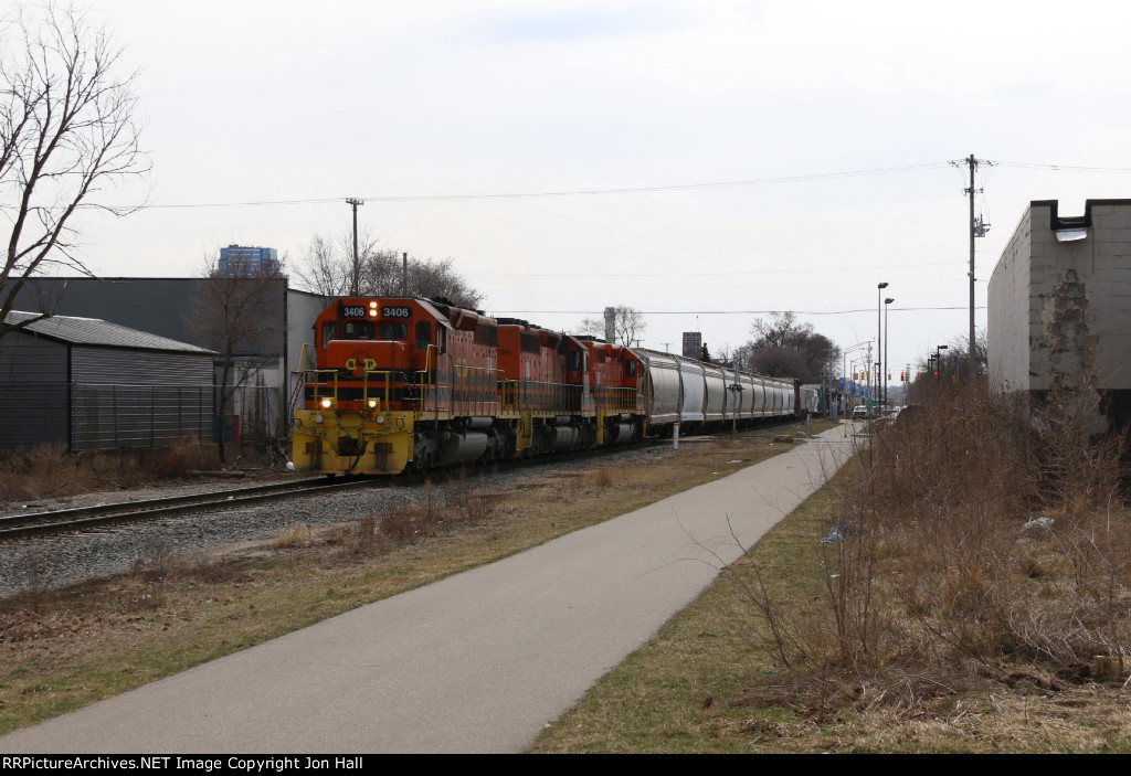 MQT 3406 leads Z151 up the West Side on its return trip to home rails